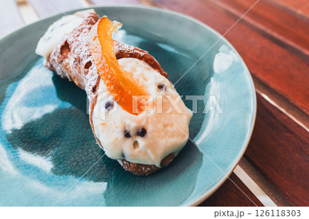 Cannoli on a plate, a sweet treat ready to be enjoyed.. Cannoli on a plate, a sweet treat ready to be enjoyed.. 126118303