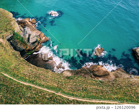 Aerial view of rugged coastline with turquoise water Aerial view of rugged coastline with turquoise water 126120096