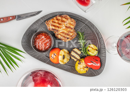 grilled pork steak with grilled vegetables. top view. copy space 126120303