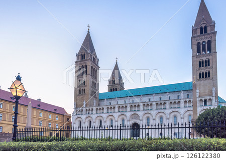 Cathedral in Pecs town in Hungary, Europe. Cathedral featuring multiple towers, elegant architectural details and a serene sky backdrop. Cathedral in Pecs town in Hungary, Europe. Cathedral featuring multiple towers, elegant architectural details and a serene sky backdrop. 126122380