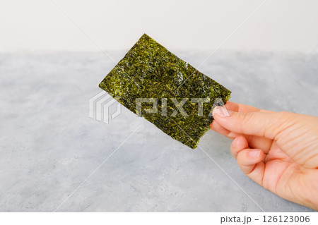 Homemade nori chip on neutral light background 126123006