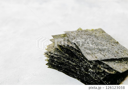Homemade nori chip on neutral light background Homemade nori chip on neutral light background 126123038