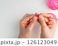 Crochet magic ring with pink yarn  126123049