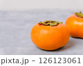 Persimmon fruits on neutral light background 126123061