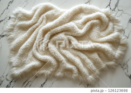 Alpaca wool throw blanket on a white background. For minimalist luxury living room. Alpaca wool throw blanket on a white background. For minimalist luxury living room. 126123698