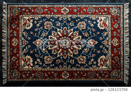 Handwoven Persian rug texture on a white background. Top view. Handwoven Persian rug texture on a white background. Top view. 126123700