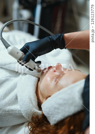 Skin treatment session at a wellness spa focusing on facial rejuvenation Skin treatment session at a wellness spa focusing on facial rejuvenation 126123779