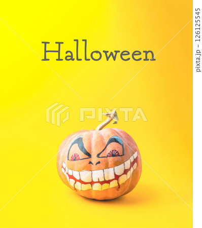 The pumpkin has a creepy, evil look to it, which is fitting for the holiday 126125545