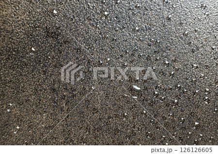 Water droplets on a cast iron macro surface. Cast iron cookware care, rust resistant, abstract pattern Water droplets on a cast iron macro surface. Cast iron cookware care, rust resistant, abstract pattern 126126605