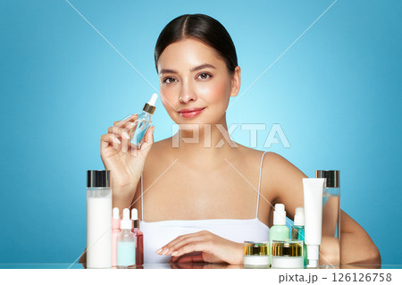 A young woman among the beauty products 126126758