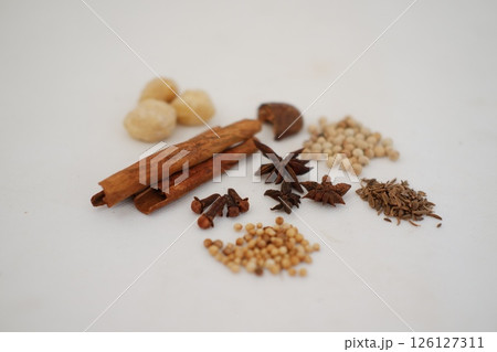 spices and herbs on a white background 126127311