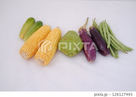 a neatly arranged assortment of fresh vegetables on a white background a neatly arranged assortment of fresh vegetables on a white background 126127493
