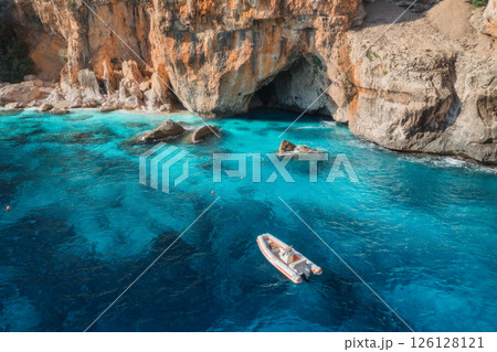 Aerial view of yacht and boats on blue sea at sunny day in summer 126128121