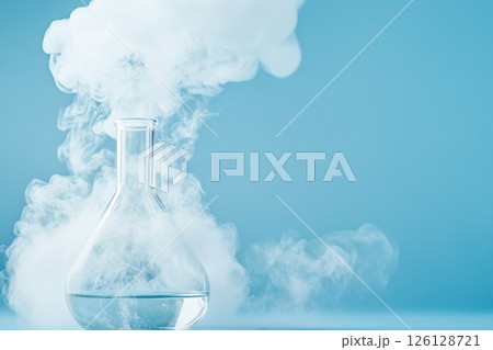 Glass flask with white smoke on a blue background, concept of chemistry, science, and experiments Glass flask with white smoke on a blue background, concept of chemistry, science, and experiments 126128721