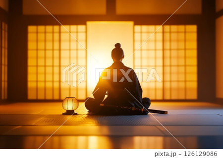 Samurai meditating in traditional japanese room with katana 126129086