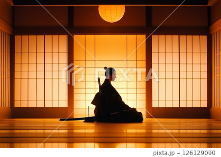 Samurai meditating in traditional japanese room with katana 126129090