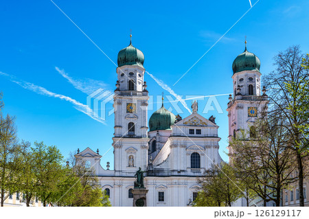 St. Stephans cathedral in Passau, Germany is an old white church with green metal domes on top of the towers 126129117