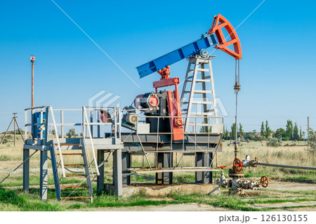 Oil pump in the field, on clear day 126130155