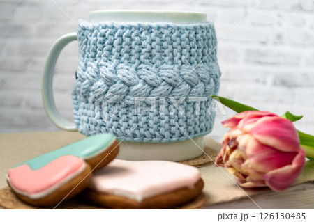 Pink tulips, an open book and a mug of freshly brewed coffee or tea. Spring set. Flatley layout 126130485