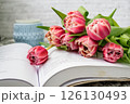 Pink tulips, an open book and a mug of freshly brewed coffee or tea. Spring set. Flatley layout 126130493