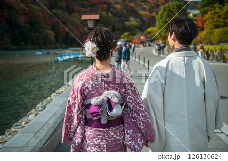 couple in kimono view Arashiyama river and autumn color, Kyoto, Japan 126130624