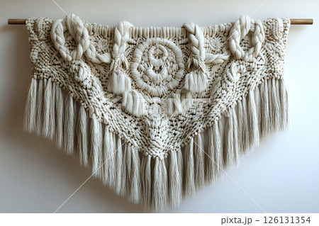 Fabric wall hanging on a white background. Boho-chic style. 126131354