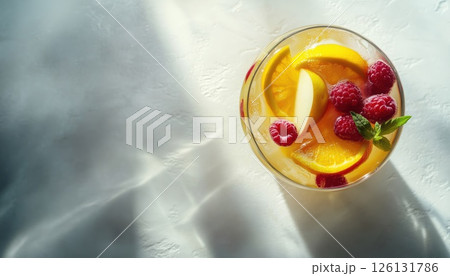 Refreshing Summer White Sangria With A Medley Of Fruits And Berries, Infused With Apple, Lemon, Oranges, And Raspberry. Light Concrete Table With Ample Space For Copy. Refreshing Summer White Sangria With A Medley Of Fruits And Berries, Infused With Apple, Lemon, Oranges, And Raspberry. Light Concrete Table With Ample Space For Copy. 126131786