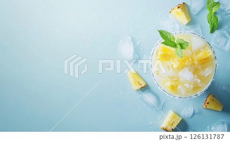 Homemade Pina Colada Cocktail On Light Blue With Pineapple, Coconut, Ice, And Mint Leaves - Top View Copy Space. A Refreshing Summer Drink. Homemade Pina Colada Cocktail On Light Blue With Pineapple, Coconut, Ice, And Mint Leaves - Top View Copy Space. A Refreshing Summer Drink. 126131787