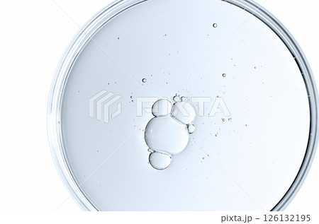 The texture of a cosmetic serum or body gel in a Petri dish. The texture of a cosmetic serum or body gel in a Petri dish. 126132195