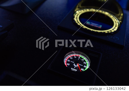 High-tech ship navigation bridge control panel with rudder angle indicator High-tech ship navigation bridge control panel with rudder angle indicator 126133042