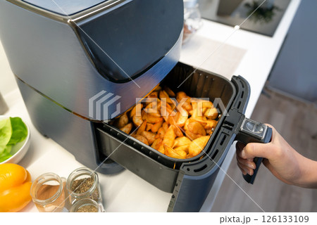 Air fryer machine in the kitchen 126133109