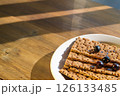 Crispbread Topped With Berries on a Sunlit Wooden Table, Gazing at Vibrant Textures. Concept of Baker, Health Food Store, Cafe 126133485