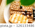 Appetizing Breakfast Platter With Grilled Egg, Crisp Crackers, and Fresh Blueberries on a Rustic Table. Healthy Eating 126133486