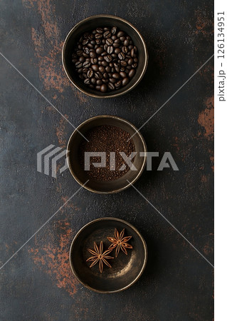 Coffee Beans, Grounds, and Star Anise in Rustic Bowls 126134951