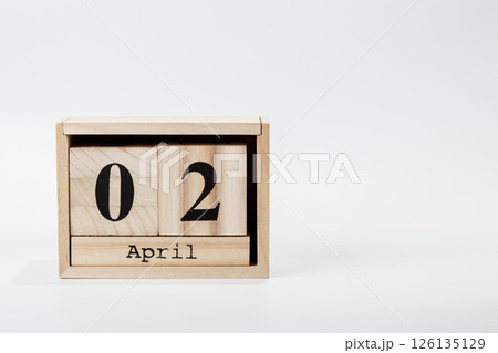 Wooden calendar April 02 on a white background 126135129