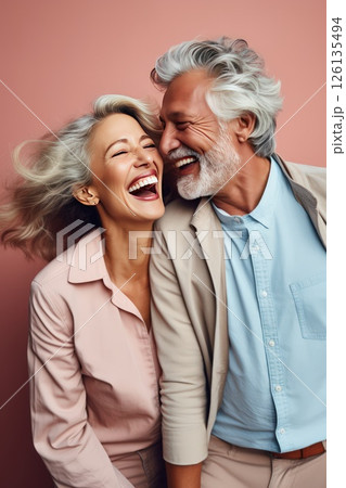 Loving middle-aged couple sharing laughter sight reminding love source of joy and happiness. Grey-haired loving couple in love sharing laughter serves reminder love wellspring of joy 126135494