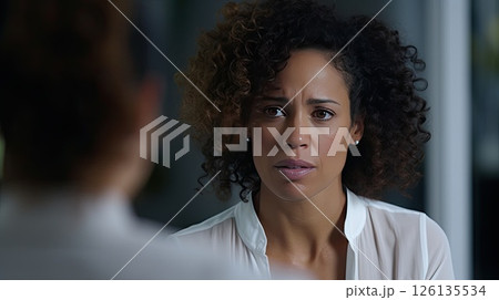 A woman at an appointment with a psychologist talks about his difficulties. Finding solutions to problems with a trusted doctor. Building resilience, forging a brighter future. A woman at an appointment with a psychologist talks about his difficulties. Finding solutions to problems with a trusted doctor. Building resilience, forging a brighter future. 126135534