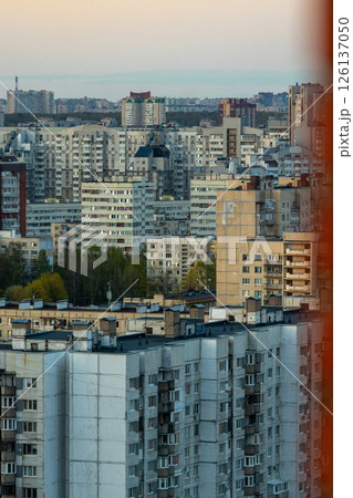 urban landscape with tall buildings and several trees, residential area, multi-storey buildings. 126137050