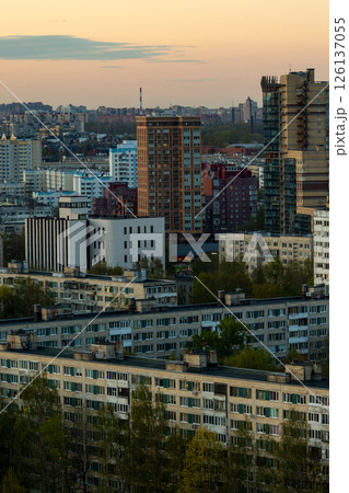 urban landscape with tall buildings and several trees, residential area, multi-storey buildings. 126137055