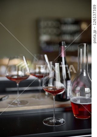 Decanter for sparkling wine on the table, Champagne tasting, Wine glasses and bottle, reflections, rose wine 126137389
