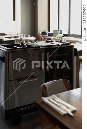 Several bottles of champagne are cooled in a niche with ice in the restaurant, wine cabinet, decanters for sparkling wine Several bottles of champagne are cooled in a niche with ice in the restaurant, wine cabinet, decanters for sparkling wine 126137409