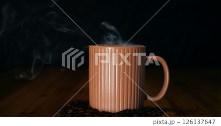 Steaming coffee mug surrounded by scattered beans, coffee evoking rich aromatic warmth, coffee inviting cozy moments and bold flavor, perfect for beverage advertising and lifestyle visuals. Steaming coffee mug surrounded by scattered beans, coffee evoking rich aromatic warmth, coffee inviting cozy moments and bold flavor, perfect for beverage advertising and lifestyle visuals. 126137647