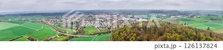 Aerial view of Bad Arolsen with residential area, fields and forest under cloudy sky Aerial view of Bad Arolsen with residential area, fields and forest under cloudy sky 126137824