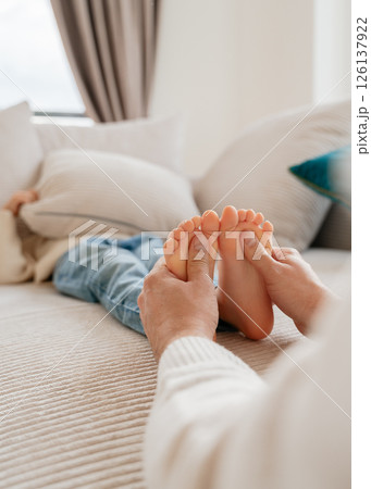 baby feet, boy feet, foot massage, dad tickles son's feet, foot tickling . High quality photo 126137922