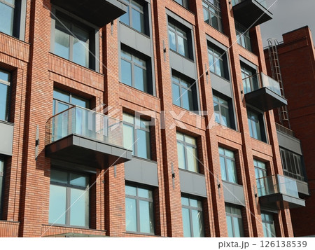 Contemporary Modern Brick Apartment Building Featuring Stylish and Elegant Glass Balconies 126138539