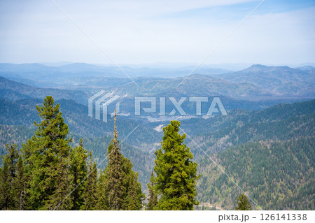 Panoramic view from Mount Kokuya at Teletskoye Ski Resort. Spring landscape with snow and mountains in Altai, Russia 126141338