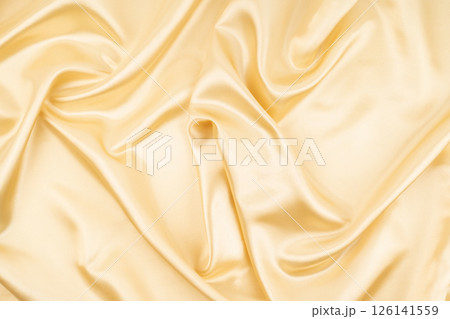 Light Yellow Silk Fabric Texture with Beautiful Waves. Elegant Background. 126141559