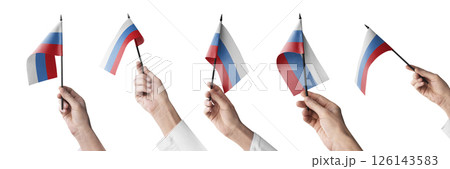The Russia flag in hand in different angles on a white background 126143583