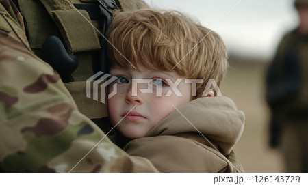 Child Embracing Military Parent In Camouflage 126143729