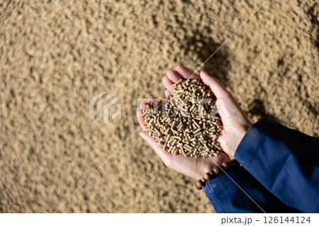Calf feed, in hands of farmer Calf feed, in hands of farmer 126144124